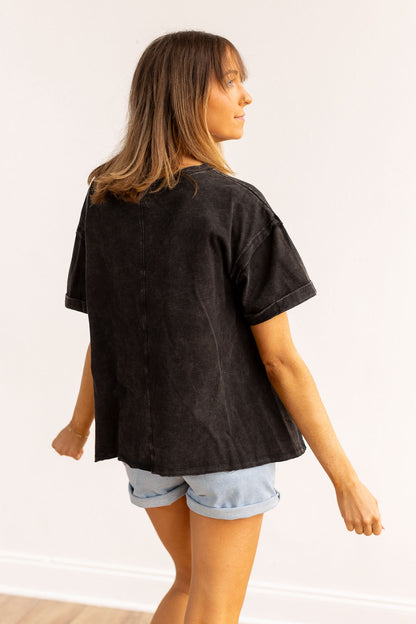 Black side slit crop with raw stitching.