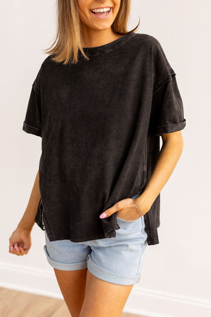 Black side slit crop with raw stitching.